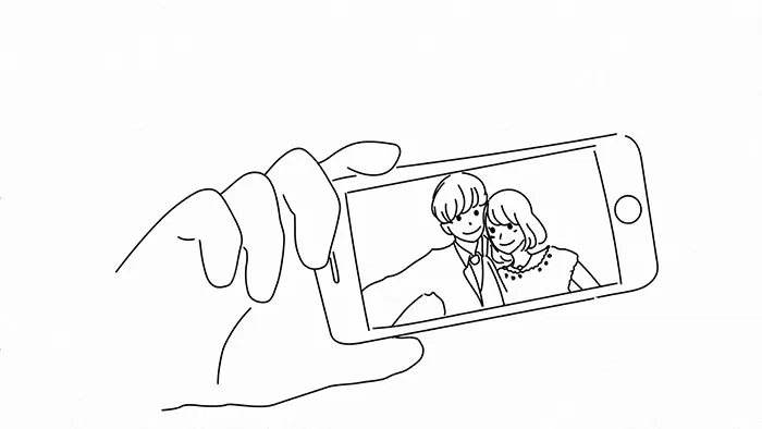 スマホで撮影する新郎新婦